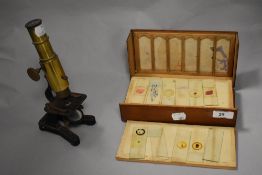 An early 20th century 'Improved Household Microscope' having rack and pinion focus from the right