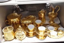 A selection of tea and dinner wares having a gilt glaze, including Royal Worcester and Crown Devon.