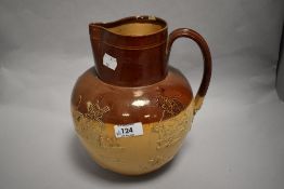 An early 20th century Doulton Lambeth harvest scene jug 22cm tall, small chip to rim.