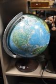 A vintage illuminated globe. Having slight damage.