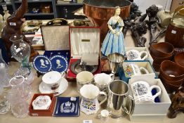 A collection of Royal Coronation and souvenir wares including cups, a Queen Mother figure and silver