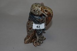 A small art pottery lidded bird form vessel, unmarked but influenced by Martin Brothers pottery.
