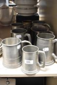 A group of six vintage pewter tankards and two silver plated examples