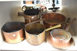 Three antique cooper cooking pans with two similar copper kitchen wares.