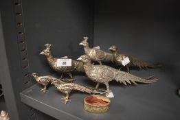 A group of six cast-spelter pheasant figures, together with a small oval box.