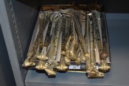 A selection of cast-brass window latches, to include screws and brass 'Gentlemen' sign