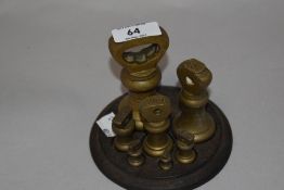 A good Victorian graduating brass weight set, comprising seven bell form weights 1lb-1/4oz all