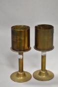 A pair of interesting WWI period brass 'trench art' pedestal vases, the brass shell upper