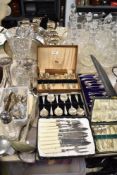 A selection of silver-plated flatware and cutlery, together with a pair of silver plated vases,