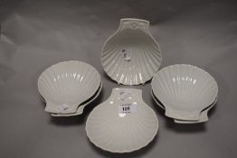 A group of eight French Pillivuyt porcelain scallop-shell form dishes, with fluted interiors and