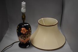 A Moorcroft pottery ovoid table lamp, tube-lined in the Oberon pattern against the washed cobalt