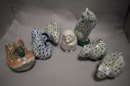 A group of mixed animal figures, mainly Herend style rabbits, cat and chicken