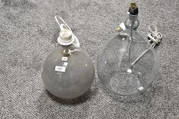 Two modern hand blown glass lamps including a mottled glass ball and tear drop design.