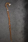 A rustic rootwood walkingstick, the handle splice joined to shaft and pegged 109cm