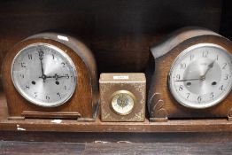 Two 1940's oak cased mantel clocks, sold along with a Swedish leather covered clock, by