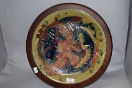 A large modern Moorcroft pottery 'Quiet Waters' pattern charger, designed by Philip Gibson and