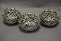A group of three 'Royal Europe' ceramic baskets, decorated in the 19th century manner with foliate