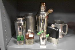 A Maple & Co (London) silver-plated cocktail shaker, of traditional design and sold along with a