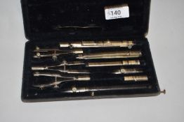 An early 20th century geometry compass set.
