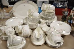 A quantity of Royal Doulton 'Twilight Rose' pattern tea and dinner wares, to include tureens,