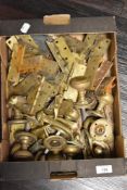 A quantity of cast brass door furniture, hinges, handles etc