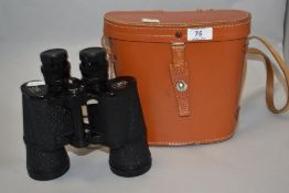 A pair of Atlas 7x50 magnification binoculars, with stitched leather case