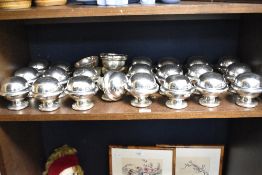 A large quantity of silver plated lidded sugar bowls, marked EPNS to underside