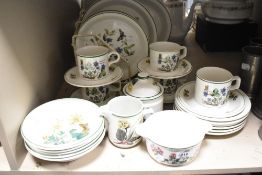 A vintage Wedgwood Florabunda pattern part dinner service with similar cups and saucers.