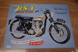 A reproduction tin sign, of BSA Gold star interest.