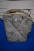 A large vintage jerry can with tap towards base, having handle, indistinctly marked to side with '