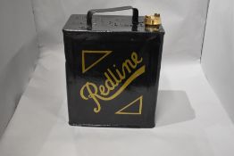 An original Redline fuel can repainted and an Esso can (no top)