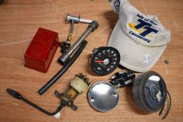 A collection of parts and spares etc, including speedometer, SN/3233/00 and oil temperature gauge.