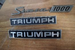 Three vintage car bonnet/ boot name badges, of Triumph and Simca interest.