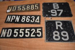 A collection of vintage number plates.