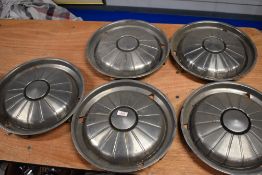 Five hub caps, thought to be Rover P6 or similar.
