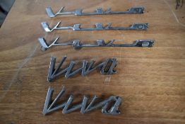 Five vintage car bonnet/ boot name badges, of Vauxhall interest.