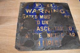 A distressed vintage enamel railway sign, 'F.R warning....'