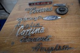 A collection of vintage car bonnet/ boot name badges etc, of Ford interest, including Cortina and