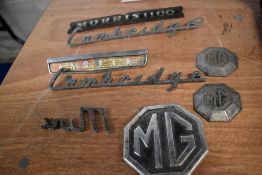 A collection of vintage bonnet/ boot name badges etc, to include MG, Mini and Morris interest.