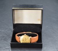 A gents gold plated Roamer Canterbury wrist watch having baton numeral dial to gold coloured face in