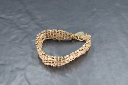 A 9ct gold multi link gate bracelet having padlock clasp, approx 29g