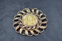 A 1902 gold sovereign with Perth mint mark in a large removable 9ct gold pendant mount, approx 22.8g