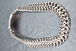 An unusual 925 grade white metal choker, having double fused curb type links finishing with a curved