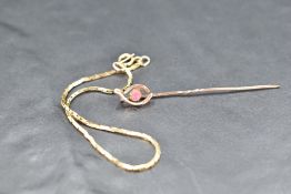 A 9ct gold fine link bracelet and yellow metal wishbone stick pin
