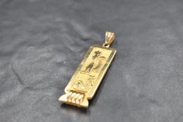 An 18ct Egyptian gold hieroglyphics pendant possibly spelling the name Avril, approx 9.3g