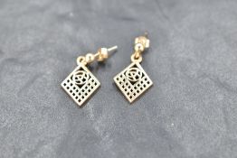 A pair of yellow metal earrings, of Charles Rennie Mackintosh design, unmarked but butterfly