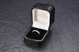 An eight stone diamond half eternity ring, approx 0.5ct total, in collared setting on a platinum