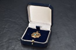 A yellow metal turquoise and seed pearl set spider and web form pendant, 2.5cm, 2.2grams thought