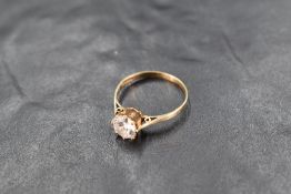 A cubic zirconia solitaire ring, approx 0.5ct in a six claw setting to knife blade shoulders on an