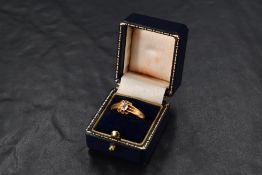 A diamond solitaire ring having an old cut diamond approx 0.3ct in a claw set open mount on an